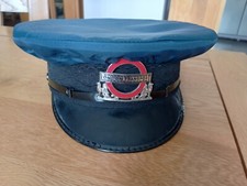 London Transport inspectors cap and badge with rain cover 1984