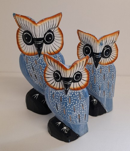 Hand carved wooden owl family - hand,
