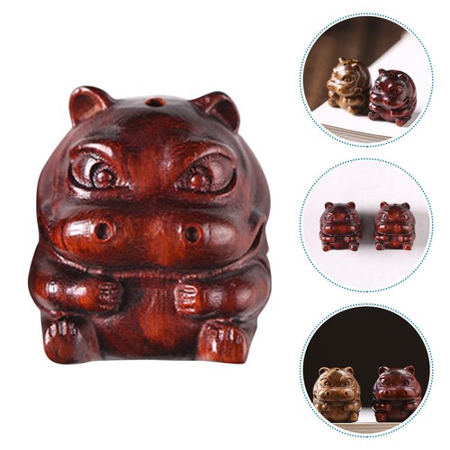 Wooden hand carved hippo - hand,