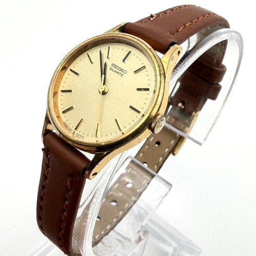Seiko gold hand round watch - gold,