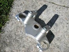 Triple clamp upper front fork