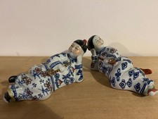 Vintage  Oriental Blue & White Porcelain Figurines , lying down with pipes . 