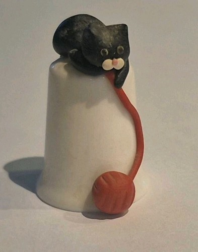 Black cat with red - , wool