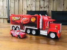 The Disney store Mack Hauler truck & Jimmy cables die cast car