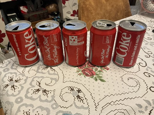 Vintage empty coke cans - x,