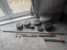 Various weight plates, barbell and dumbbells. Cast iron and sand filled. 