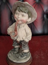 Figurine Young boy smoking a