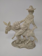 OLD MAN RIDING DONKEY