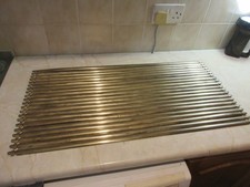 Lot of 21 vintage brass Fleur-de-lie design stair rods, 32" long, polished.