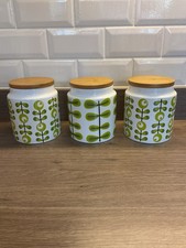 Three retro green Canisters