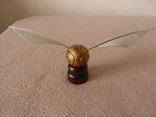 Harry Potter Plastic Golden Snitch Model On A Wooden Stand