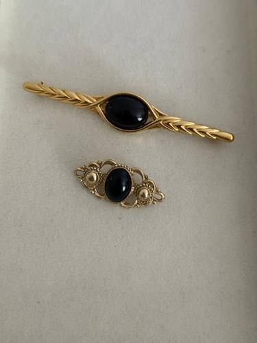 Vintage black gold brooch - &,