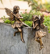 2 bronze sitting Garden