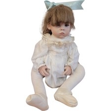 Porcelain Doll in White Velvet Dress with Brown Hair and Blue Bow