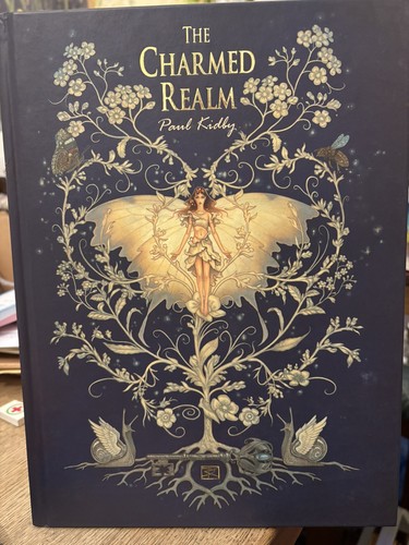 The charmed realm - the, |