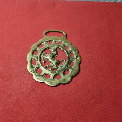 Cast horse brass with rearing - cast,