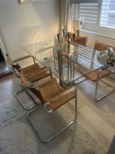 4 Mid Century Style Chrome And Leather Chairs