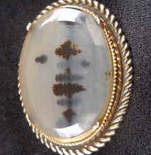 Dendritic Moss Agate set in a gilt metal brooch.