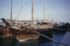 Dubai Creek Scene Dhows And Barges Moored At A Quay On Dubai Creek- Old Photo 1