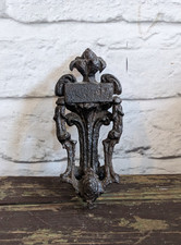 Antique cast iron door knocker