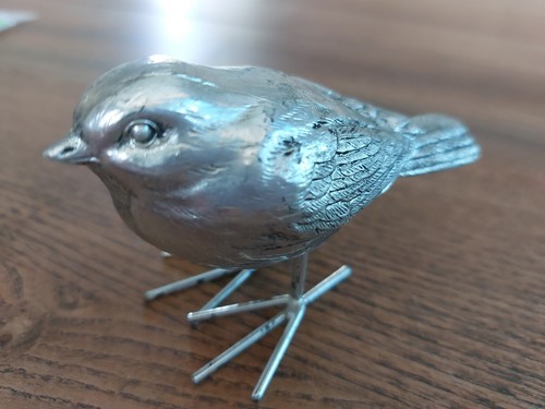 Realistic silver coloured - coloured, bird