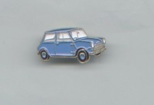 Lapel pin badge of a classic pale blue MINI car ,  metal with enamel