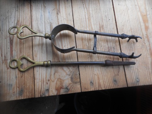 Old brass poker and tongs
