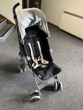 Maclaren black pushchair buggy suitable from birth, comes with buggy storage bag