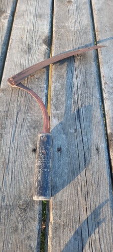 Old rustic vintage hand - hand, sickle