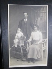 Postcard of child on rocking