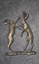 Solid bronze fighting hares - fighting,