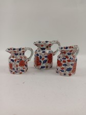 Set of 3 Antique Victoria Ironstone Jugs with Floral & Face Motif