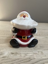An Avon Father Christmas Jar with his beard acting as the Serving Nibbles Plate