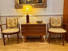 A pair of super mid century Mcintosh chairs. Newly upholstered.