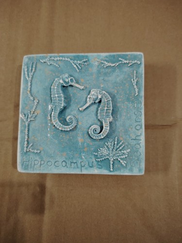 Two decorative cast - , wall