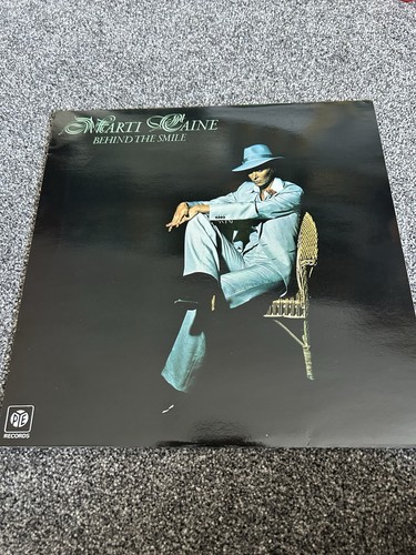 Marti caine behind the smile - behind,