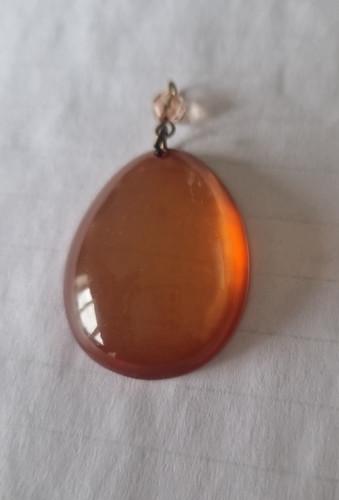 Amber plastic resin pendant - plastic/resin,