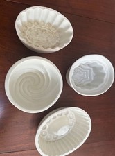 Four vintage ceramic jelly moulds