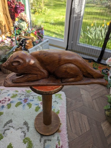 Carved wooden otter sculpture - carved,