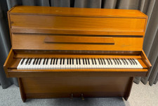 DANEMANN UPRIGHT PIANO. LIGHT