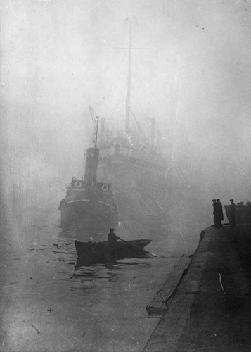 Tug towing boat down the - towing,