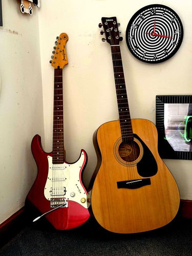 Two yamaha guitars - two,