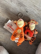 2 x small tigger toys, one