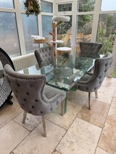 SOLID GLASS DINING TABLE AND 4
