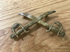 nice looking very early military crossed swords brass badge original item