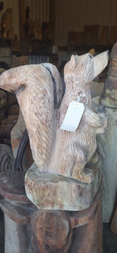 Chainsaw carving squirrel home - chainsaw,