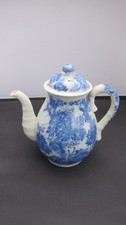 Decorative coffee jug with lid with glazed blue decoration.
