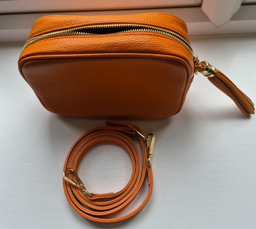 New orange leather handbag