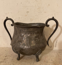 An antique pewter sugar bowl