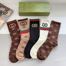 These Gucci knee-high socks/